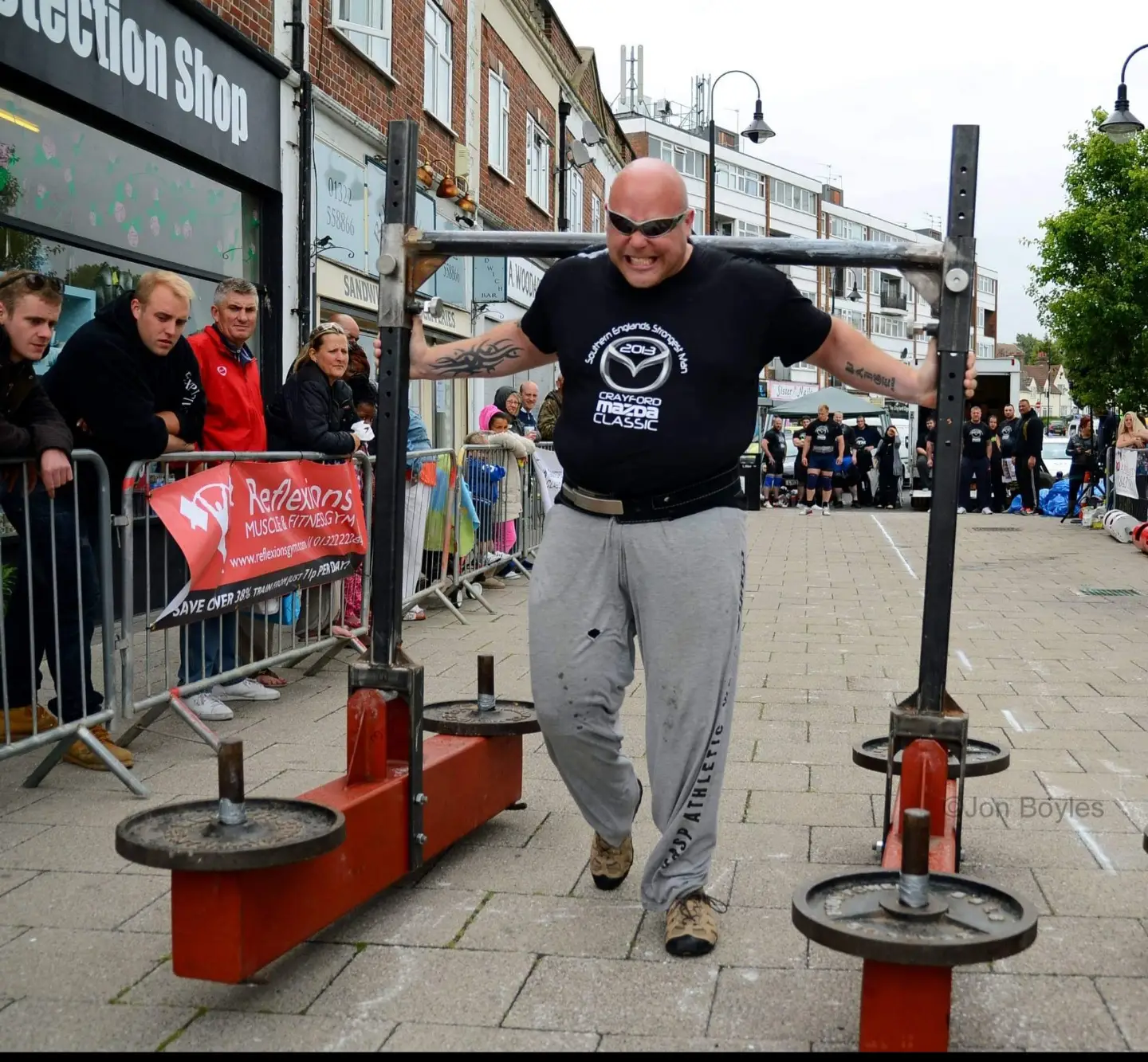 Strongman athlete competing at a strength event